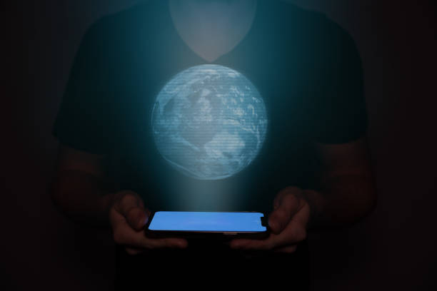 istock A man in the future holds a on which the planet earth is projected. New technology. 1484505542