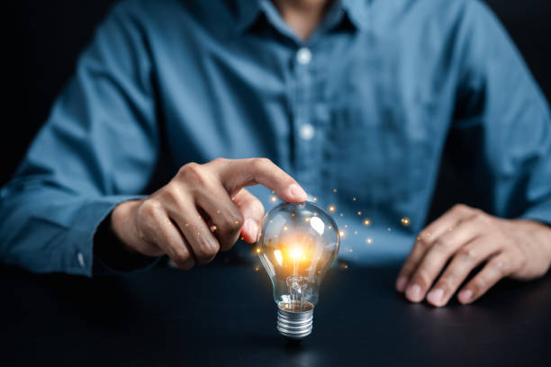 istock Businessman holding light bulb with business target planning idea and creativity innovation development leadership investment growth and success development, goal, strategy 1484515295