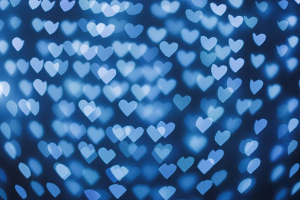 istock beautiful hearts made of lights on a blurred background 1484523654