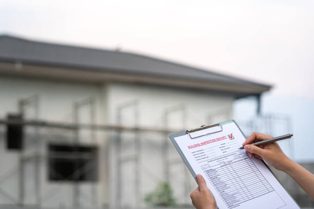 istock Inspecting building house on the report form. 1484525504