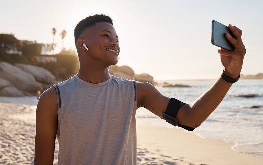 Sports, fitness selfie and black man at beach for social media, video call or training blog update on running goals. Athlete, runner or african person with exercise, cardio or workout profile picture