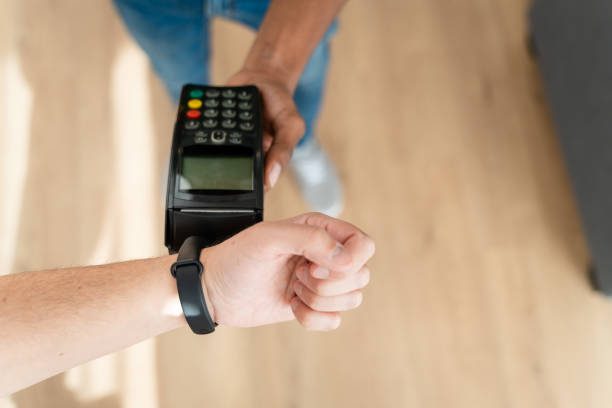 istock Crop man paying with credit card 1484533507