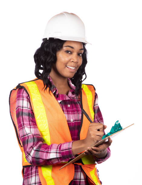 istock African American Female Construction Worker Holds Clipboard Eyes to Camera Vertical 1484542009