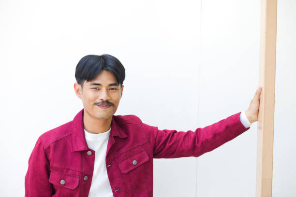 istock Relaxed  portrait young thai man in red jacket 1484546167