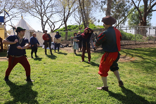 4-15-2023: Visalia, California: Swordsmen in period costumes at a Renaissance Faire