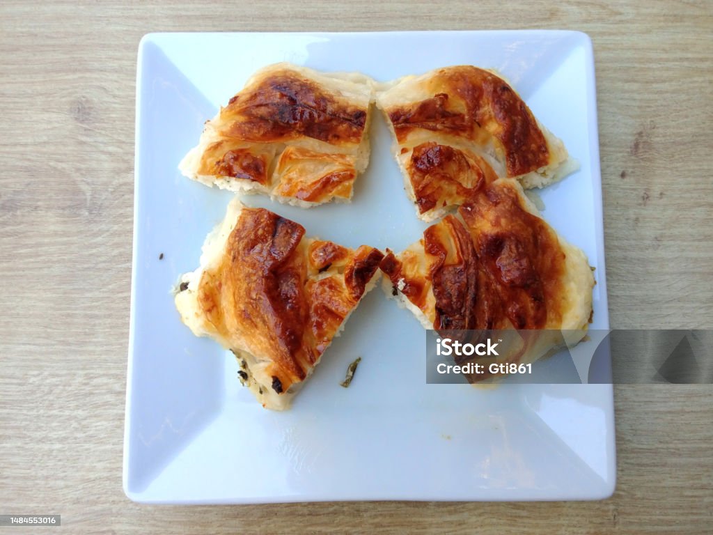 Pastry - Börek Patty, puff pastry in White colored plate on table. Baked Stock Photo