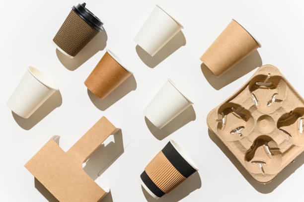 istock Paper eco-friendly disposable cups on a white background. Various disposable cups for vending. 1484555109