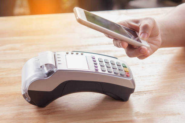 istock Contactless payment by smartphone. Payment with NFC technology 1484555139