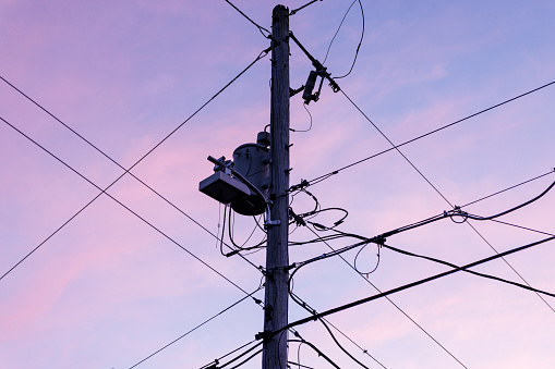 Power trunking cables with evening sky backdrop.
