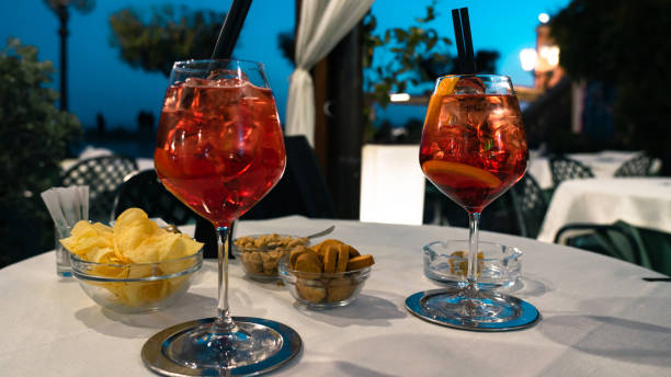 istock Two glasses of campari spritz served on a table. 1484569410