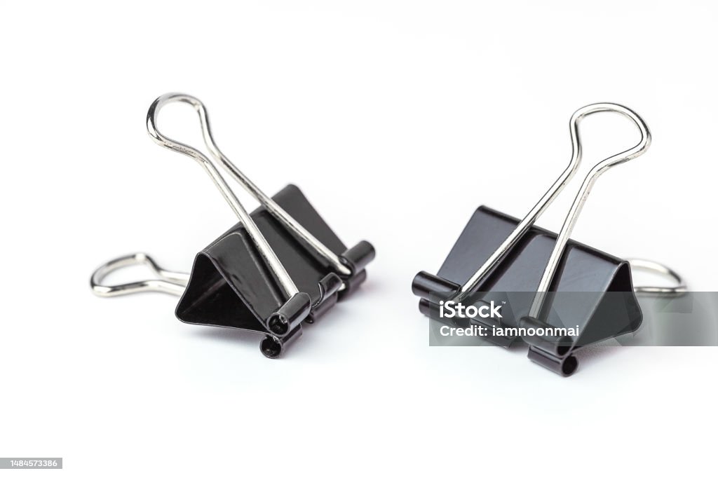 Binder clips on white background Binder clips on white background for the concept of office and school stationary. Paper Clip Stock Photo