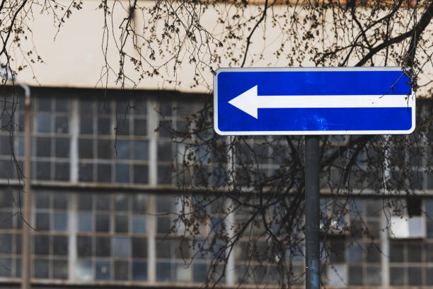 istock Road sign. White arrow on blue background 1484574723