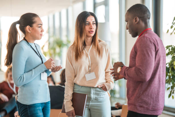 istock Multiracial Colleagues Socializing At Conference 1484574745