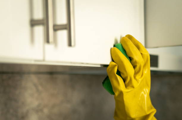 istock Hand with gloves washing in kitchen 1484575136