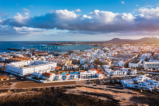 Corralejo aerial cityscape, port city in Fuerteventura, beautiful panoramic view of Canary islands, Spain. Panoramic aerial view of Corralejo town on Fuerteventura island, Canary Islands, Spain.
