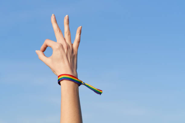istock Woman's hand okay gesture with LGTB rainbow bracelet for Pride Day 1484577200