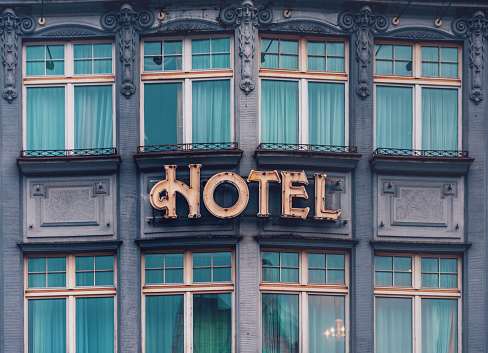 Prague, Czech Republic, December 26, 2022: an old and rusted hotel sign on a historical building in the city center