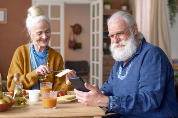 istock Grandparents having video call on smartphone 1484580085