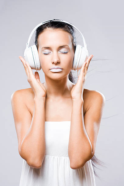 istock White noise, brunette with headphones. 148458042