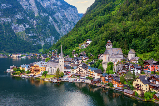 Aerial view of austrian mountain village Hallstatt and Hallstatter lake. Beautiful summer time. Salzkammergut, Austria. Hallstatt village over Hallstatter See, in Salzkammergut, Austria.