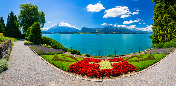 View over the Wörthersee and the villages Maria Wörth, Pörtschach with Austrian Alps and Klagenfurt in the distance