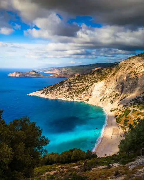 Photo of Aerial drone view of iconic turquoise and sapphire bay and beach of Myrtos, Kefalonia (Cephalonia) island, Ionian, Greece. Myrtos beach, Kefalonia island, Greece. Beautiful view of Myrtos beach.