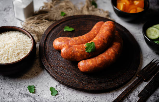 istock Raw uncooked sausages Chorizo in a plate 1484594277