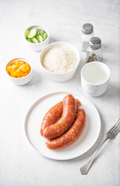 istock Raw uncooked sausages Chorizo in a plate 1484594286
