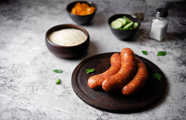 istock Raw uncooked sausages Chorizo in a plate 1484594305