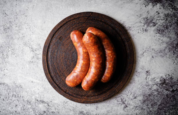 istock Raw uncooked sausages Chorizo in a plate 1484594307
