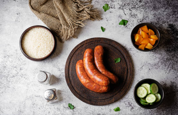 Raw uncooked sausages Chorizo in a plate