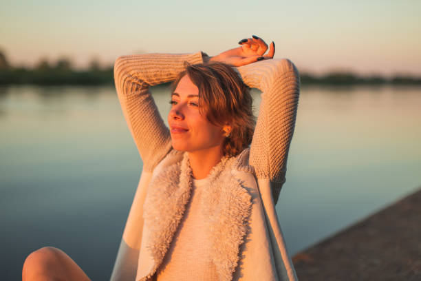 istock Woman enjoying sunset 1484594849