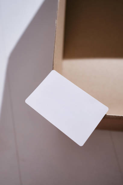 istock Blank business card, postcard on a colored background. Place for text and information. Mockup 1484596941