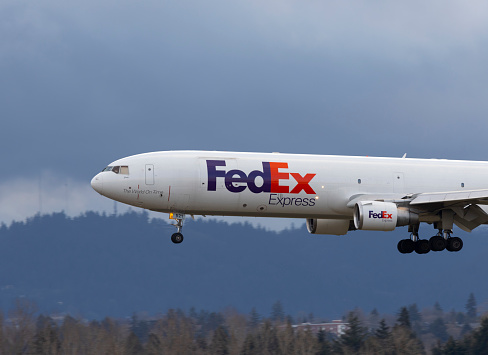 Portland, Oregon, USA - March 10, 2023: The FedEx Express MD-11 named Janie landing at Portland International Airport.