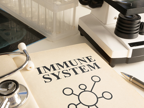Immune system is shown using a text on the paper of the book
