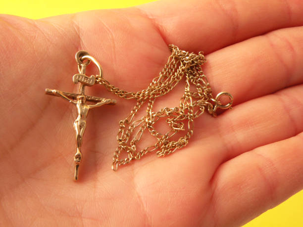 istock Hand holding gold crucifix 1484624600