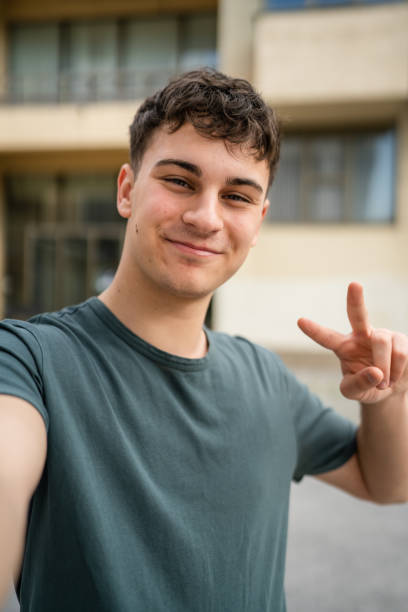 portrait of young Caucasian man teenager 18 or 19 years old outdoor stock photo