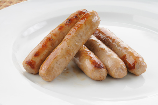 Close up of a plate of maple smoked link sausages