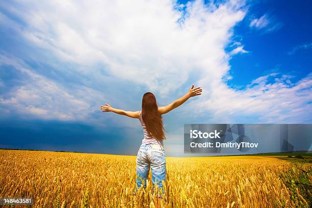 Girl With Outstretched Arms Is Enjoys Summer Day Stock Photo - Download Image Now - Adult, Agricultural Field, Agriculture