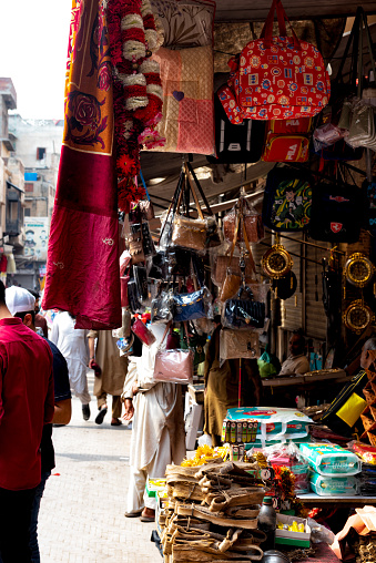 View of the Dehli gate market in Lahore. The colourful street of this picturesque market is full of passers by.