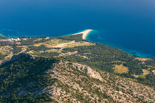 Zlatni Rat (Golden Cape or Golden Horn) famous turquoise beach in Bol town on Brac island, Dalmatia, Croatia. Zlatni Rat sandy beach at Bol on Brac island of Croatia in summertime.