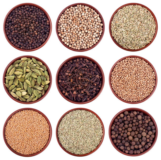 istock Assortment of different spices in ceramics bowls isolated on white 148465818