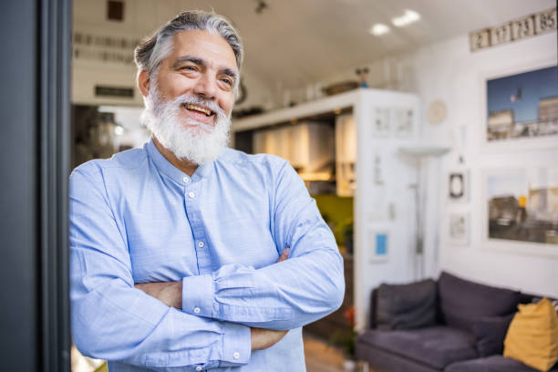 istock Senior man with arms crossed 1484659449