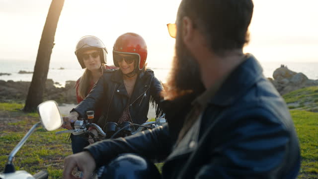 Friends outdoors with motorbike