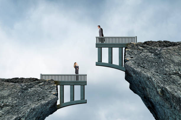 Woman Looking up At Man On Mismatched Bridge Construction - fotografia de stock