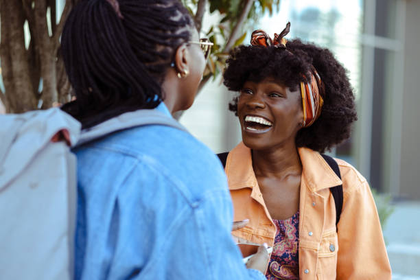 istock Two African American friends talking and laughing 1484669463