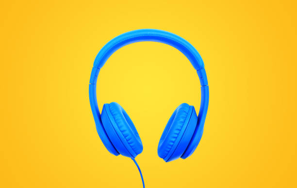 istock Blue headphones isolated on yellow background. Music object concept 1484671156