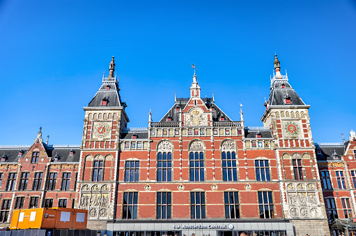 Amsterdam, Netherlands - March 28, 2023: Exterior of the historic Amsterdam Centraal rail terminal