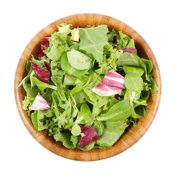 Wooden bowl of a mixed salad meal Wooden bowl of mixed salad salad bowl photos stock pictures, royalty-free photos & images