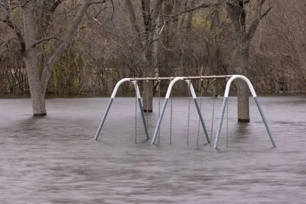Floodwaters of the Mississippi River have overtaken a playground.